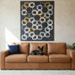 Patterned quilt with interlocking square design on a dark background
