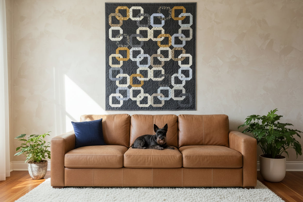 Patterned quilt with interlocking square design on a dark background