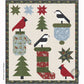 Christmas-themed quilt with patterns of trees, stars, and birds on a beige background.